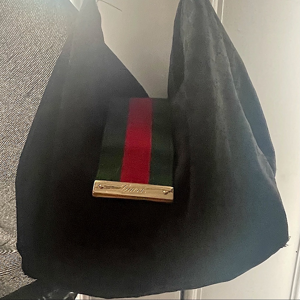Black Gucci bag has some wear,